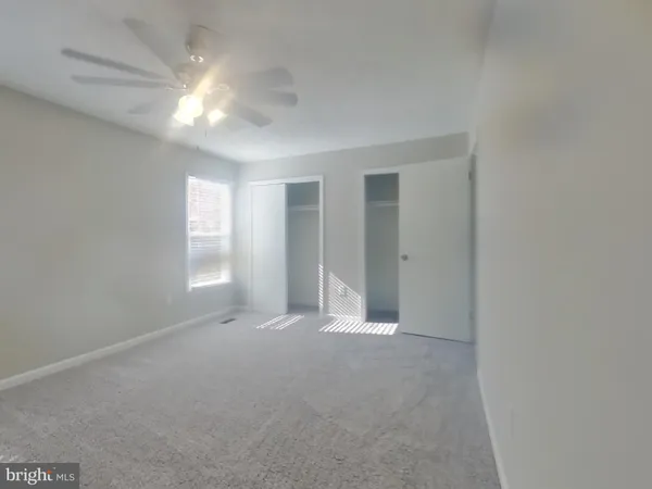 a view of empty room with windows