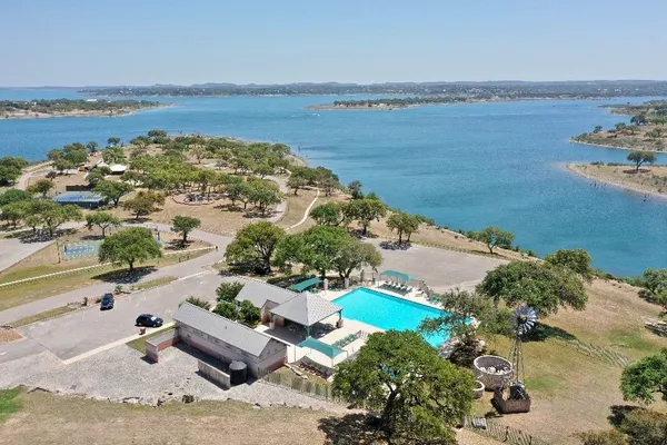 an aerial view of a house with a lake view