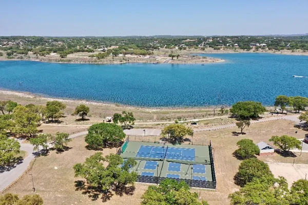 an aerial view of ocean with residential house with outdoor space