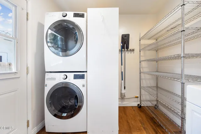 a view of a hallway with washer and dryer