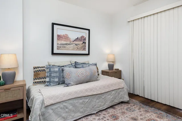 a bedroom with bed and window