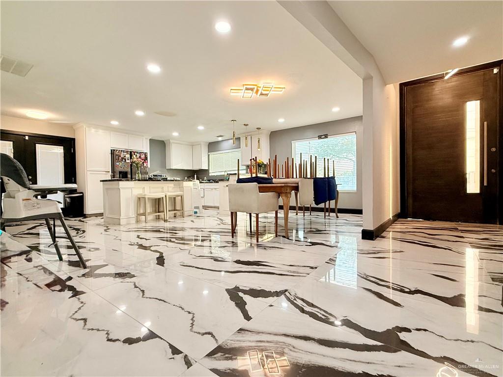 940 West Mile 3 Road Mission, TX 78573 - Photo 12 of 25 a view of a kitchen and kitchen island