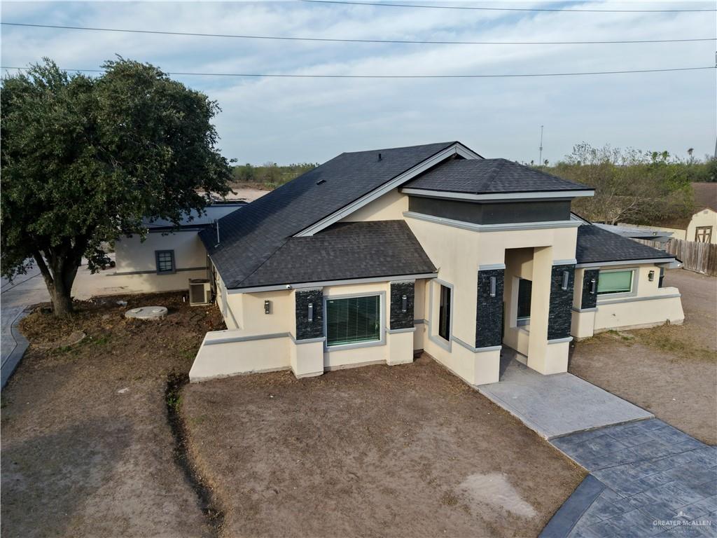 940 West Mile 3 Road Mission, TX 78573 - Photo 6 of 25 a view of a house with a patio