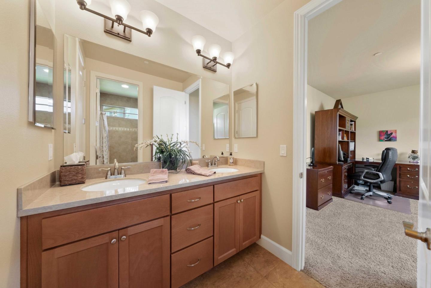 1477 Corte De Maria San Jose, CA 95120 - Photo 19 of 29 a spacious bathroom with a double vanity sink double mirror and hallway