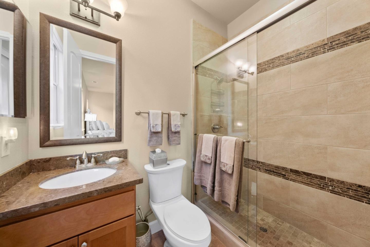 1477 Corte De Maria San Jose, CA 95120 - Photo 10 of 29 a bathroom with a granite countertop sink toilet a mirror and shower