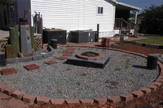 a view of a backyard with furniture