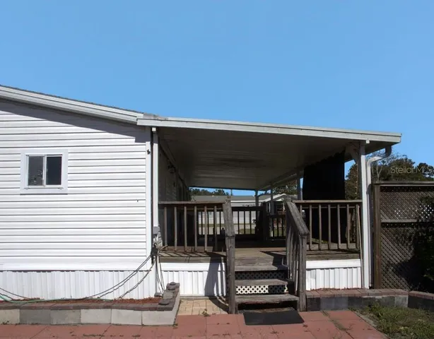 a view of front door and deck