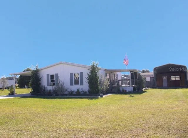 a view of a house with a yard