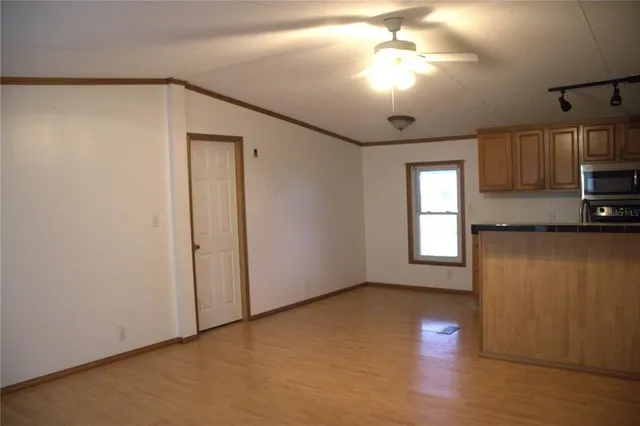a kitchen with a sink stove and refrigerator