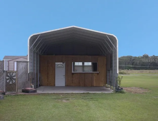 a view of workspace with wooden floor and windows