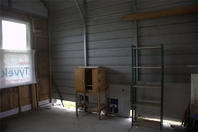 a view of a backyard with plants