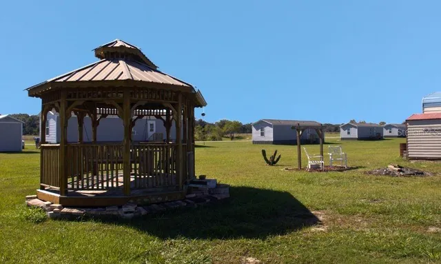 a view of a lake in middle of forest