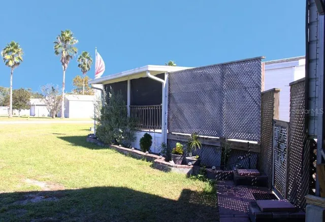 a view of a swimming pool with a patio