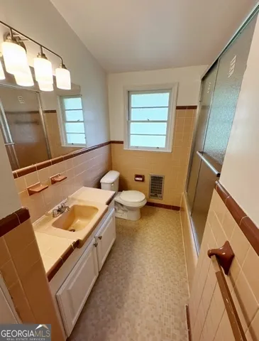 a view of a hallway with a chandelier