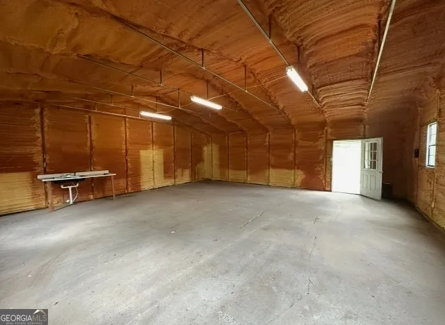 a view of a swimming pool and a yard