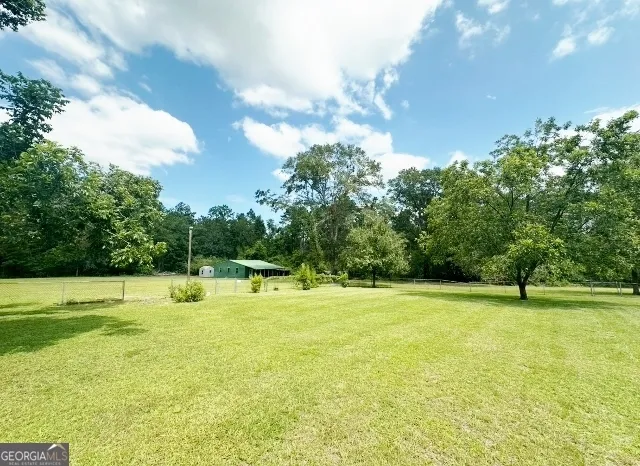a aerial view of a house with a yard