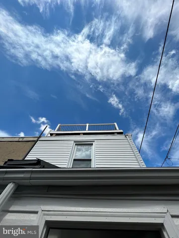 a kitchen with a refrigerator sink and cabinets
