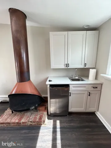 a bathroom with a sink and mirror