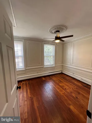 a balcony with table and chairs