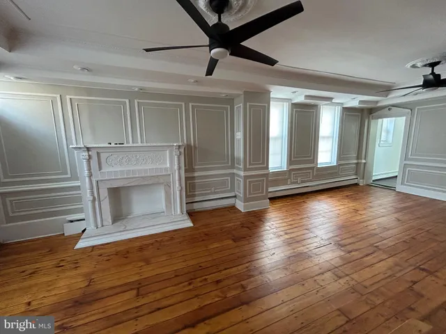 a view of an entryway with wooden floor