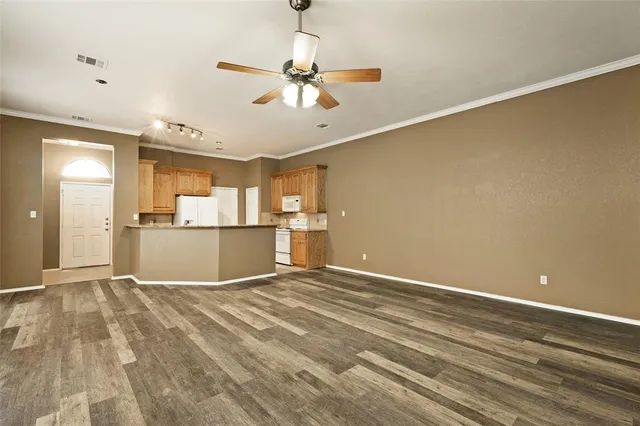 a view of a kitchen with a sink and cabinets