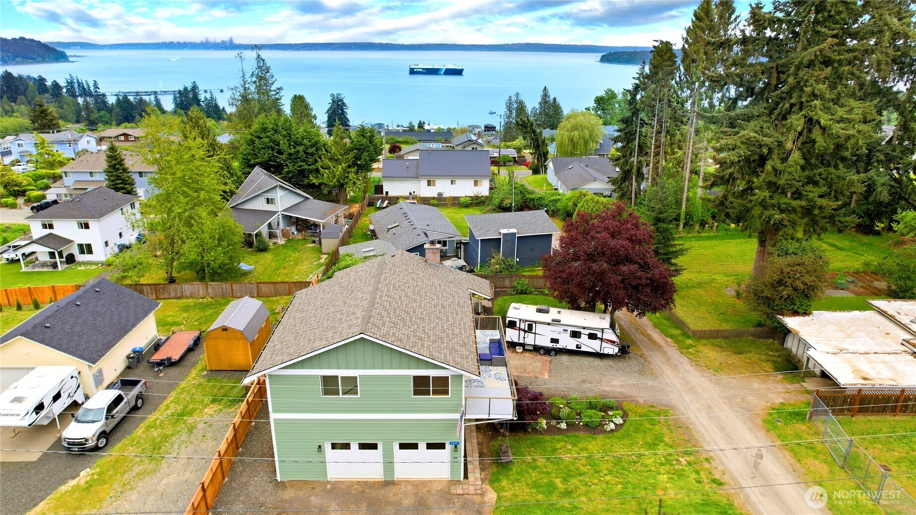 2417 Cedar Street East Port Orchard, WA 98366 - Photo 1 of 40 a aerial view of a house with swimming pool and ocean view