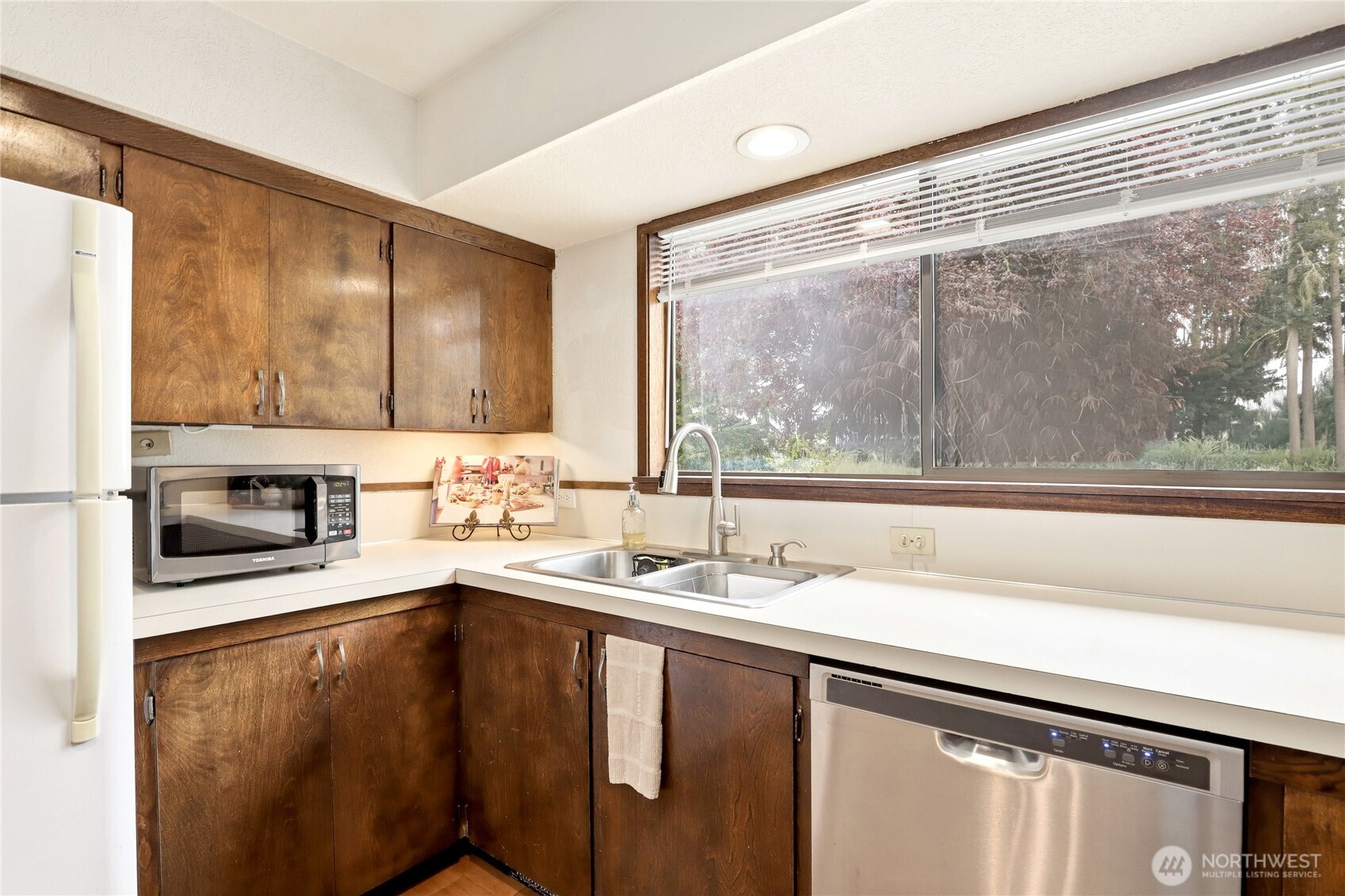 2417 Cedar Street East Port Orchard, WA 98366 - Photo 21 of 40 a kitchen with a sink and a microwave