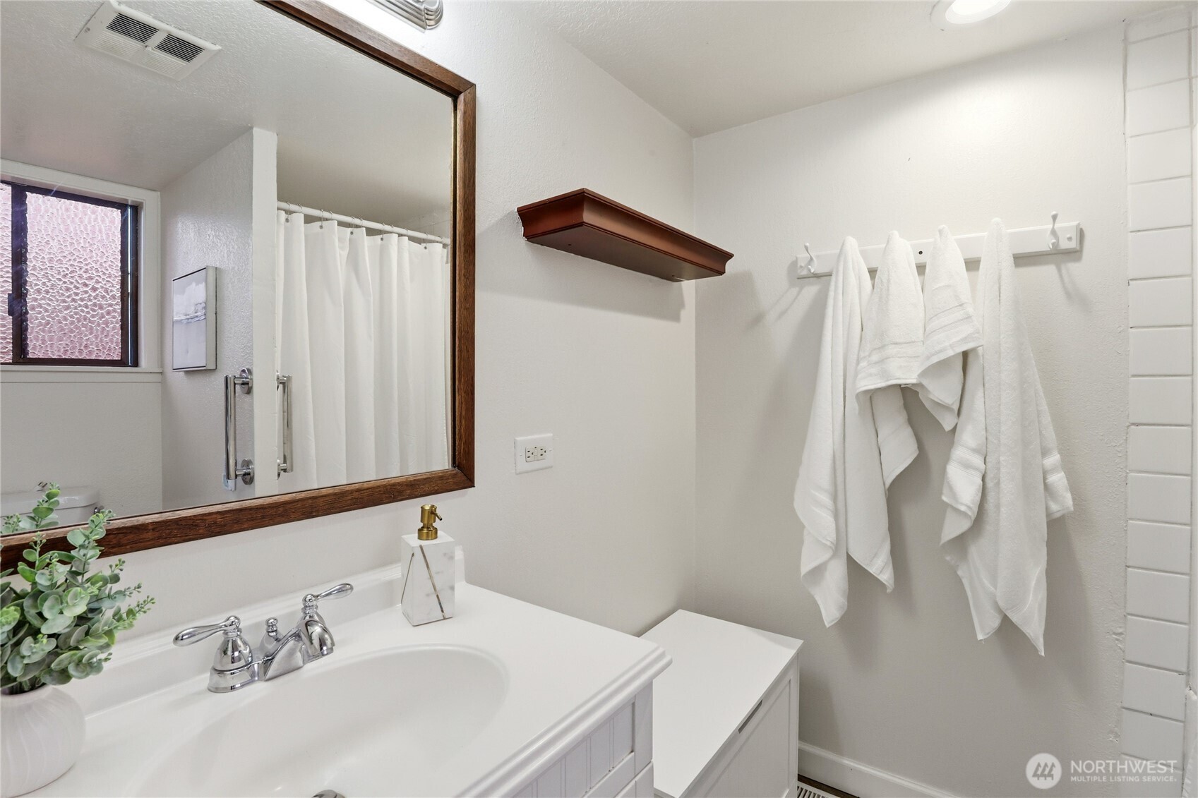 2417 Cedar Street East Port Orchard, WA 98366 - Photo 24 of 40 a bathroom with a sink vanity and a mirror