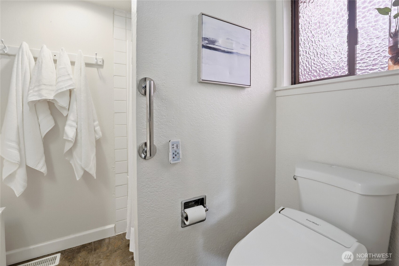2417 Cedar Street East Port Orchard, WA 98366 - Photo 25 of 40 a white toilet sitting next to a bathroom sink