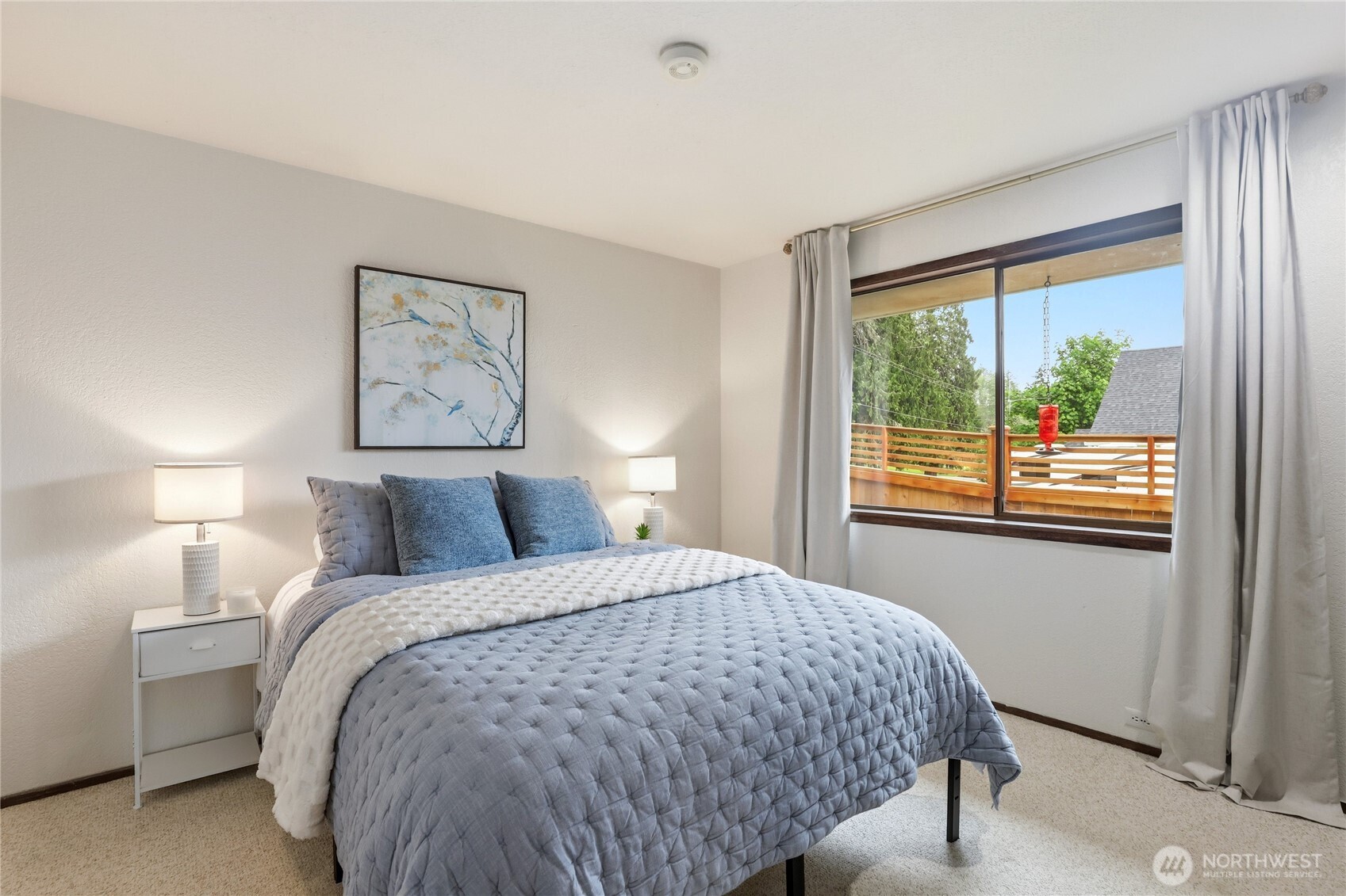 2417 Cedar Street East Port Orchard, WA 98366 - Photo 26 of 40 a bed sitting in a bedroom next to a window