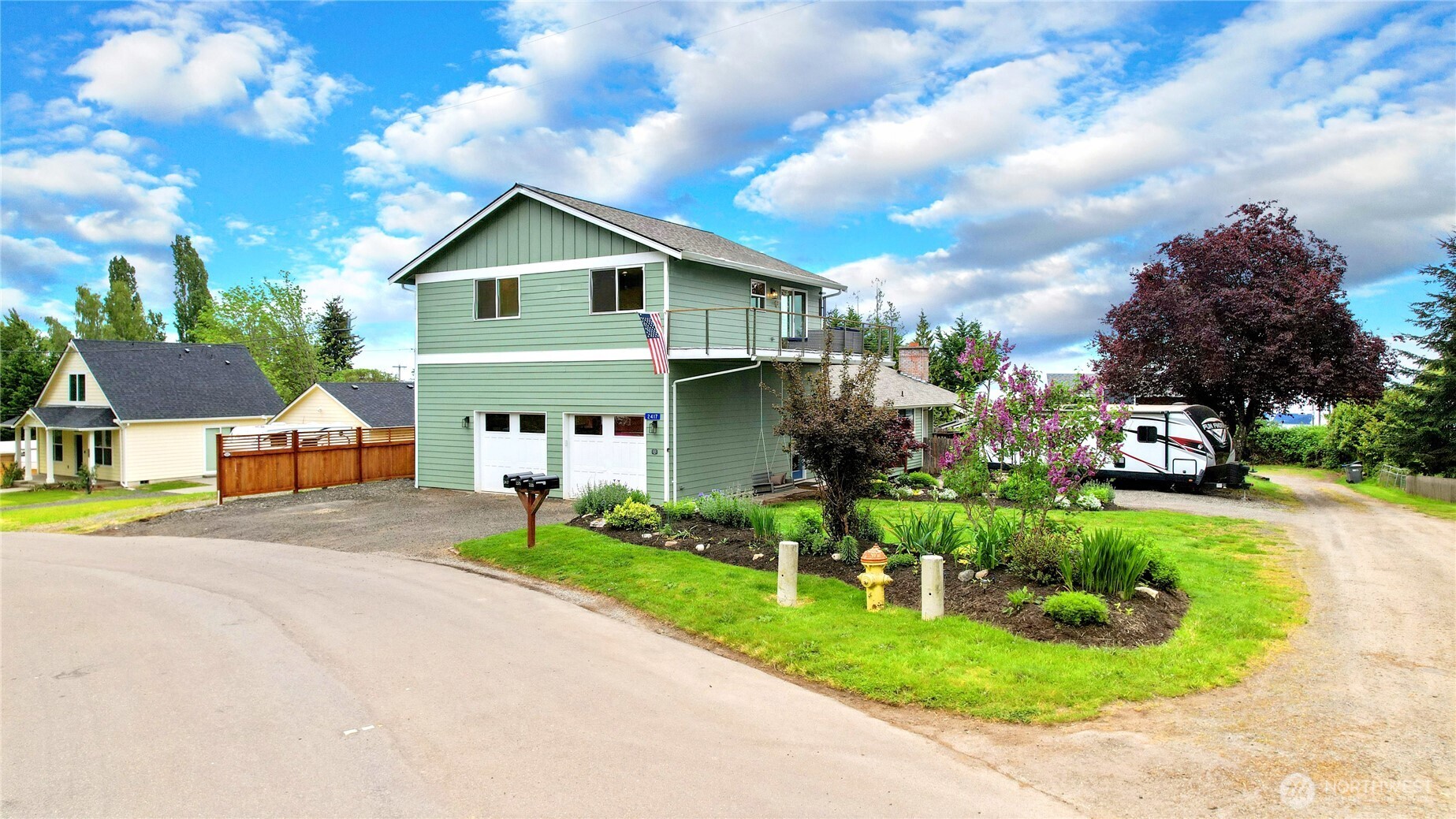 2417 Cedar Street East Port Orchard, WA 98366 - Photo 3 of 40 a front view of a house with a yard and garage