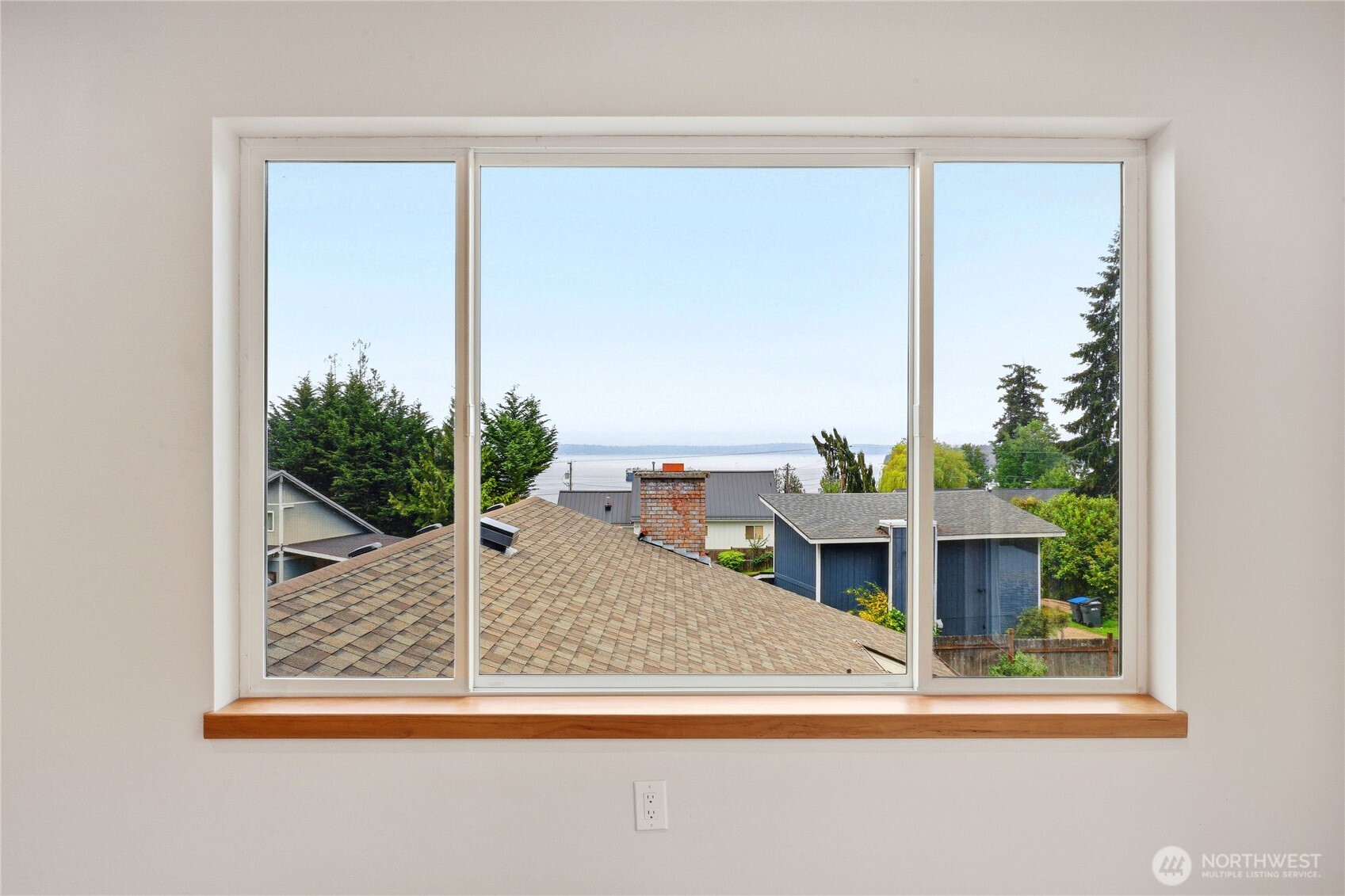 2417 Cedar Street East Port Orchard, WA 98366 - Photo 32 of 40 a view of a living room and a floor to ceiling window