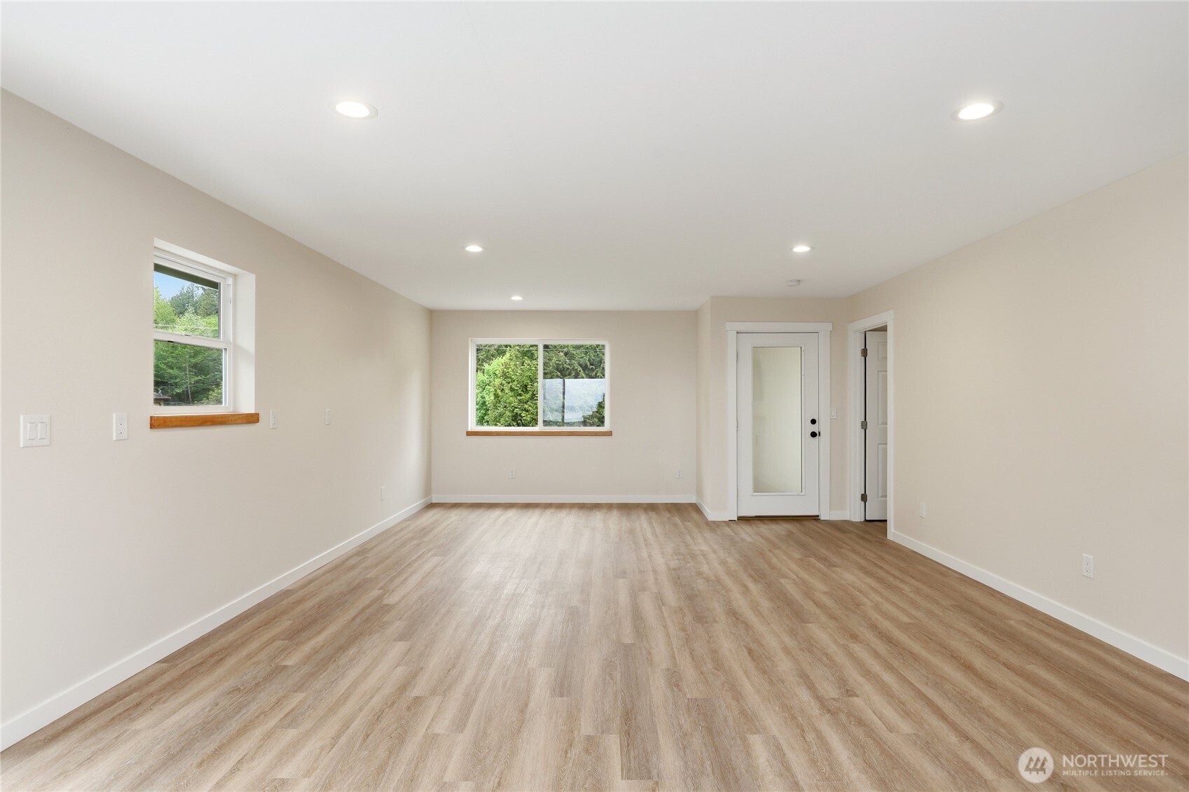 2417 Cedar Street East Port Orchard, WA 98366 - Photo 33 of 40 an empty room with wooden floor and windows