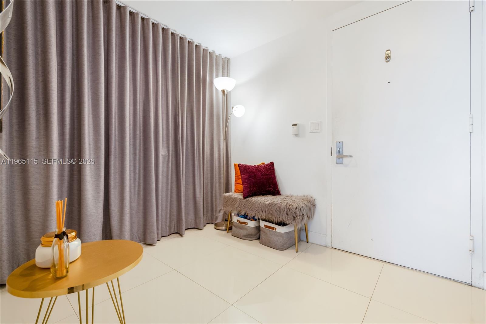 495 Brickell Avenue, Unit 4704 Miami, FL 33131 - Photo 18 of 24 a bedroom with a bed and chair