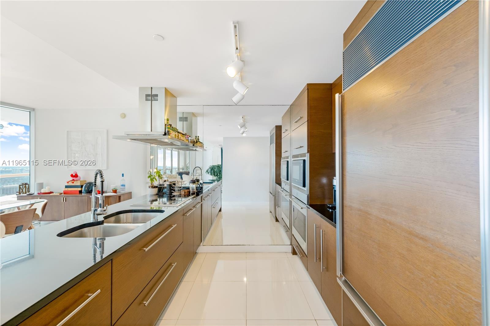 495 Brickell Avenue, Unit 4704 Miami, FL 33131 - Photo 19 of 24 a view of a kitchen with a sink and cabinets