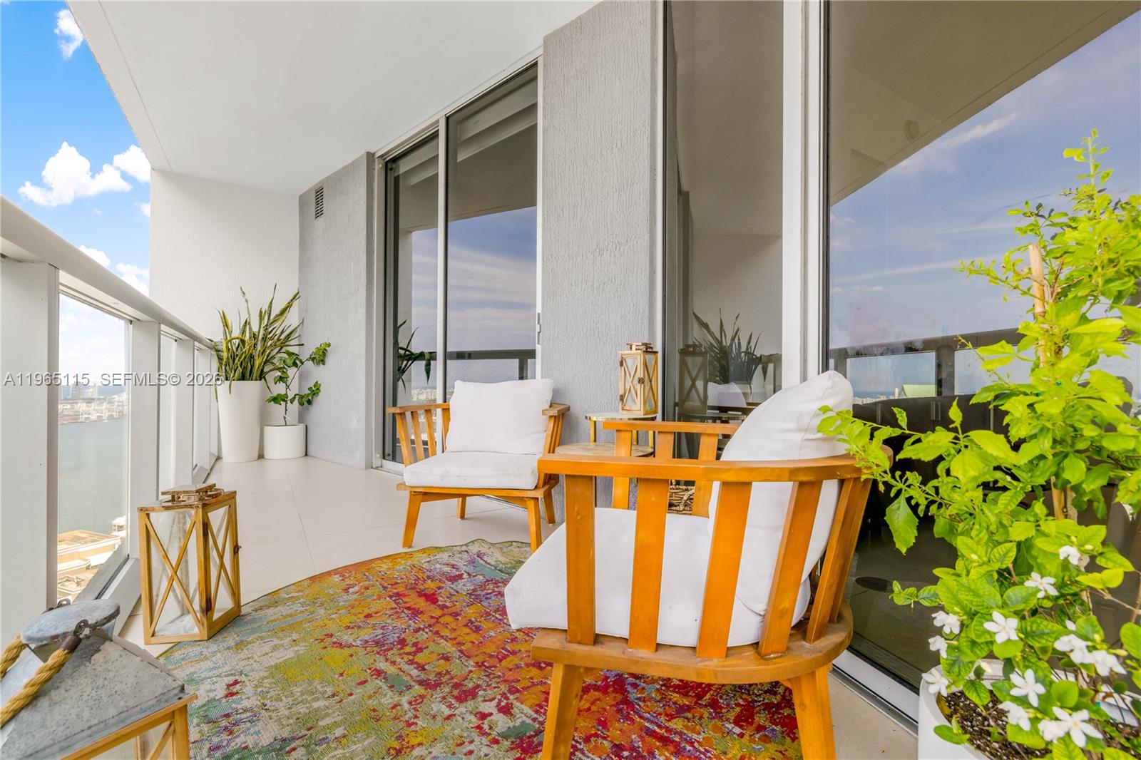 495 Brickell Avenue, Unit 4704 Miami, FL 33131 - Photo 24 of 24 a balcony with table and chairs