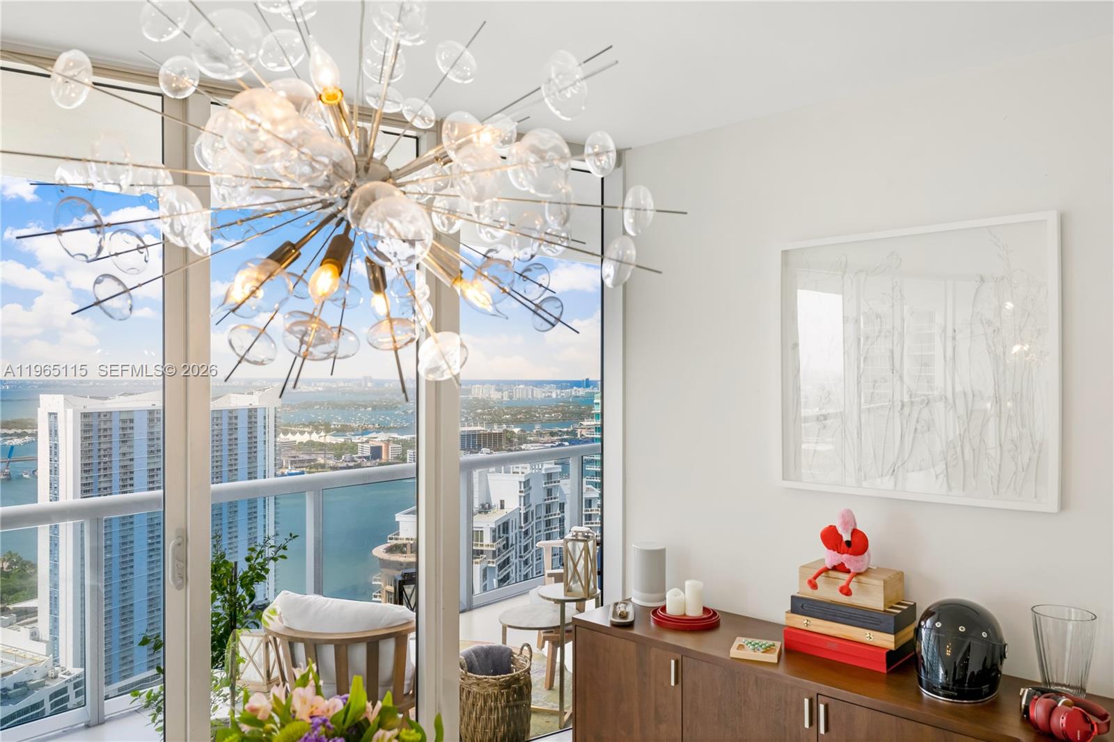 495 Brickell Avenue, Unit 4704 Miami, FL 33131 - Photo 5 of 24 a room with furniture and a window