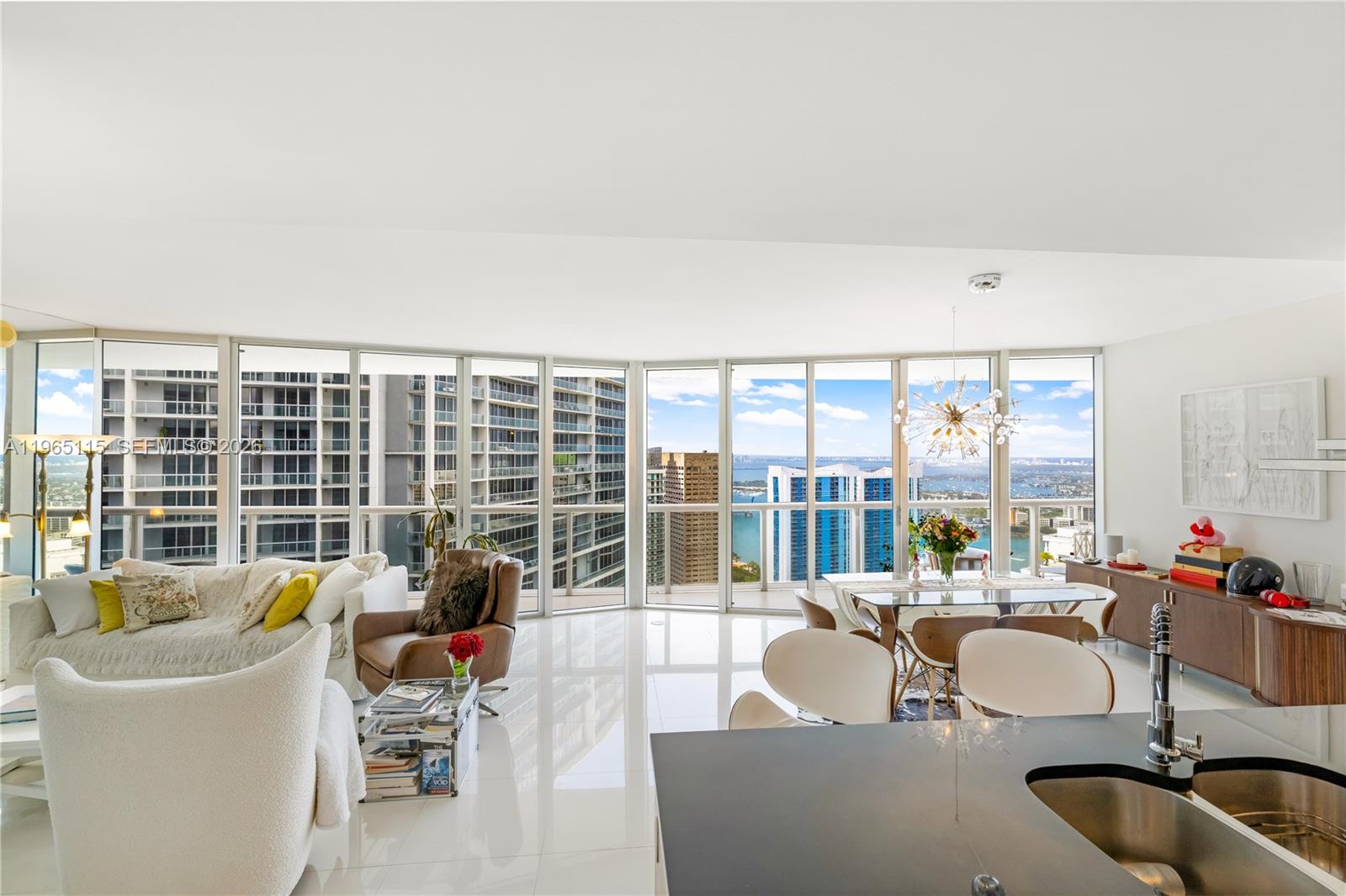 495 Brickell Avenue, Unit 4704 Miami, FL 33131 - Photo 6 of 24 a living room with furniture and a large window