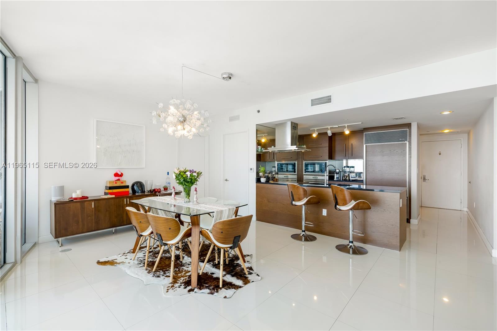 495 Brickell Avenue, Unit 4704 Miami, FL 33131 - Photo 7 of 24 a view of a dining room with furniture