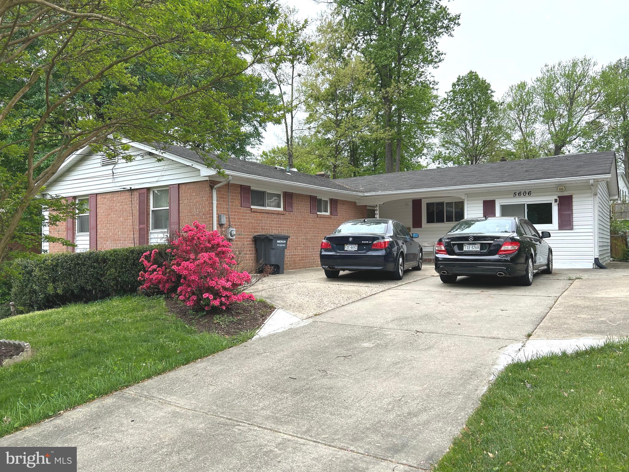 5606 Ventnor Lane Springfield, VA 22151 - Photo 1 of 24 a front view of a house with cars parked