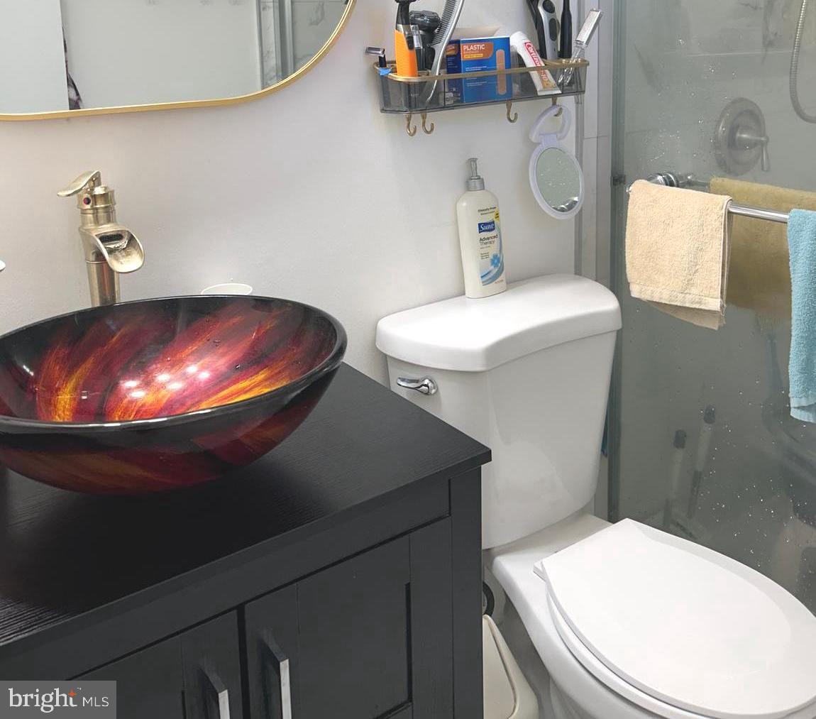 5606 Ventnor Lane Springfield, VA 22151 - Photo 12 of 24 a bathroom with a toilet and a sink