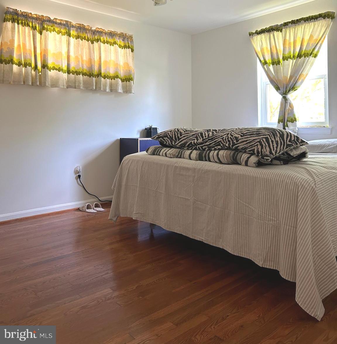 5606 Ventnor Lane Springfield, VA 22151 - Photo 13 of 24 a living room with a bed furniture and a window