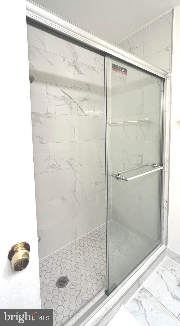 5606 Ventnor Lane Springfield, VA 22151 - Photo 15 of 24 a bathroom with a shower