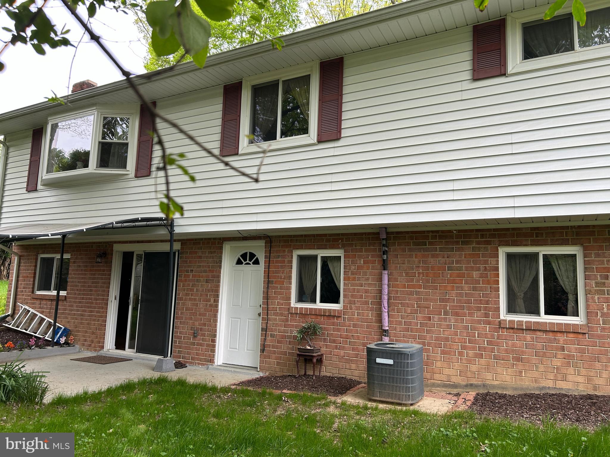 5606 Ventnor Lane Springfield, VA 22151 - Photo 3 of 24 a view of a house with a yard and large tree