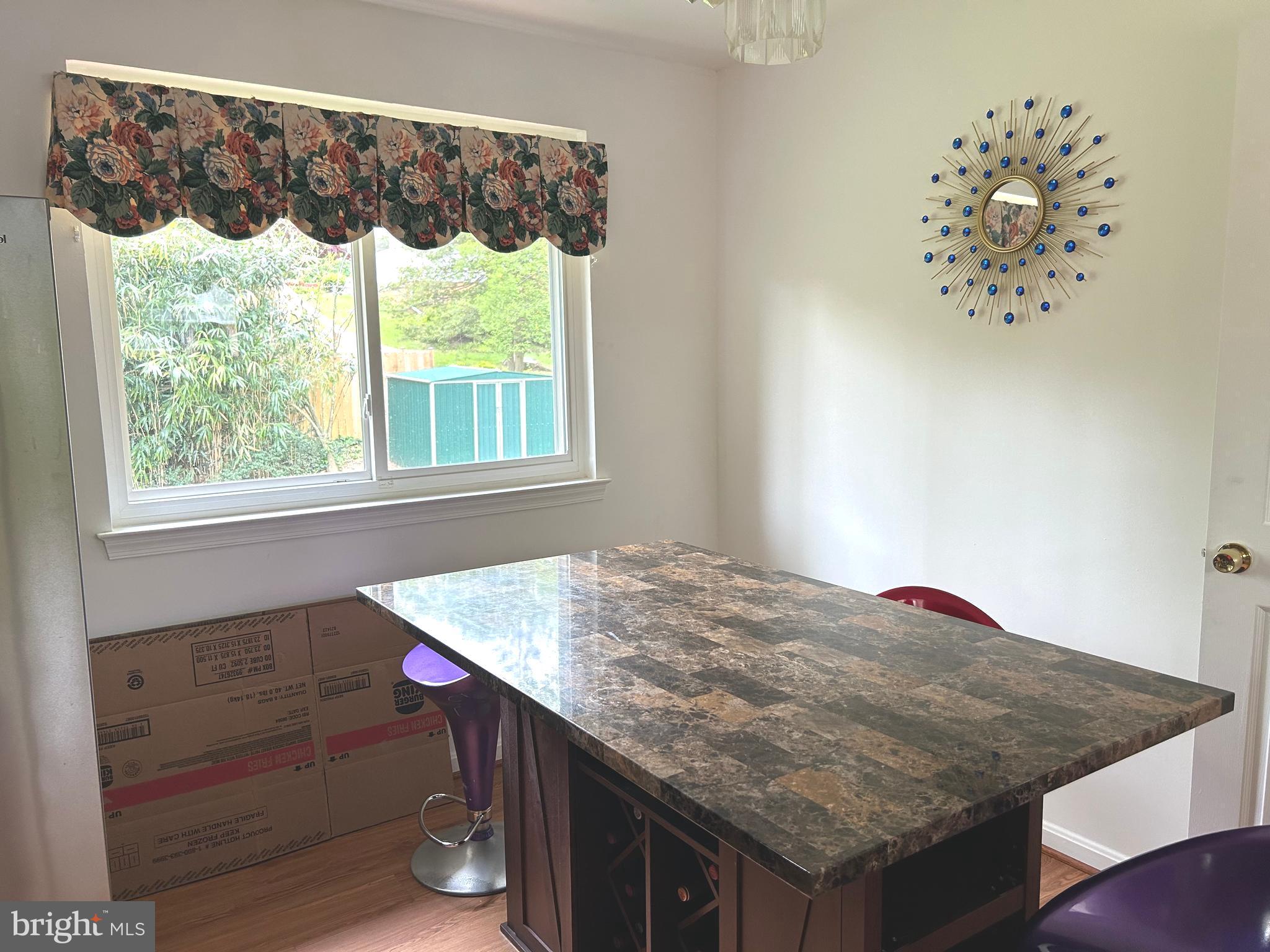5606 Ventnor Lane Springfield, VA 22151 - Photo 8 of 24 a bathroom with a granite countertop sink and a window