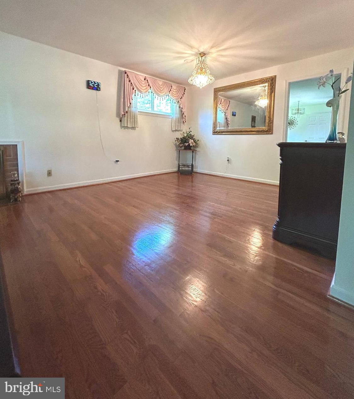5606 Ventnor Lane Springfield, VA 22151 - Photo 9 of 24 an empty room with wooden floor and windows