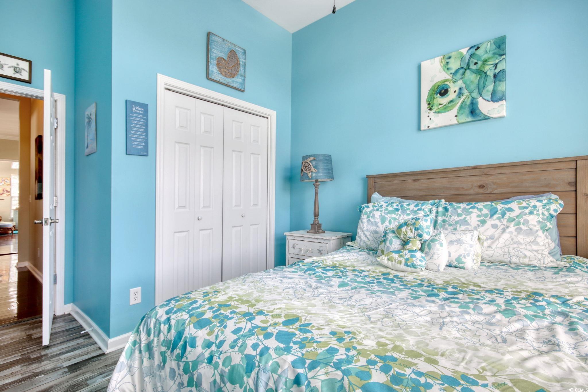 47 Pinfeather Drive Murrells Inlet, SC 29576 - Photo 16 of 35 Bedroom with dark wood-style flooring and a closet