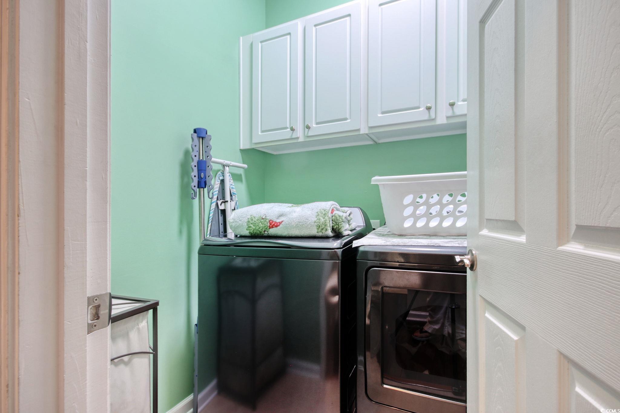 47 Pinfeather Drive Murrells Inlet, SC 29576 - Photo 17 of 35 Laundry area with cabinet space and separate washer and dryer