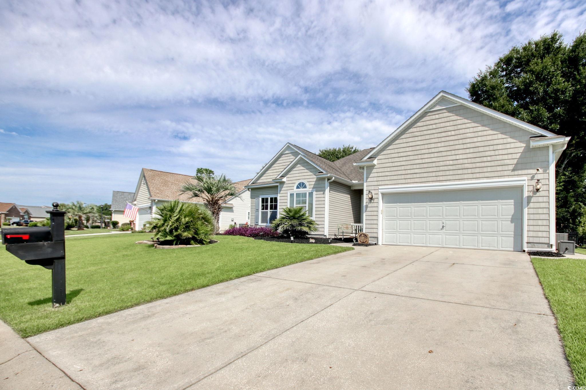 47 Pinfeather Drive Murrells Inlet, SC 29576 - Photo 2 of 35 Ranch-style house with concrete driveway, an attached garage, and a front yard