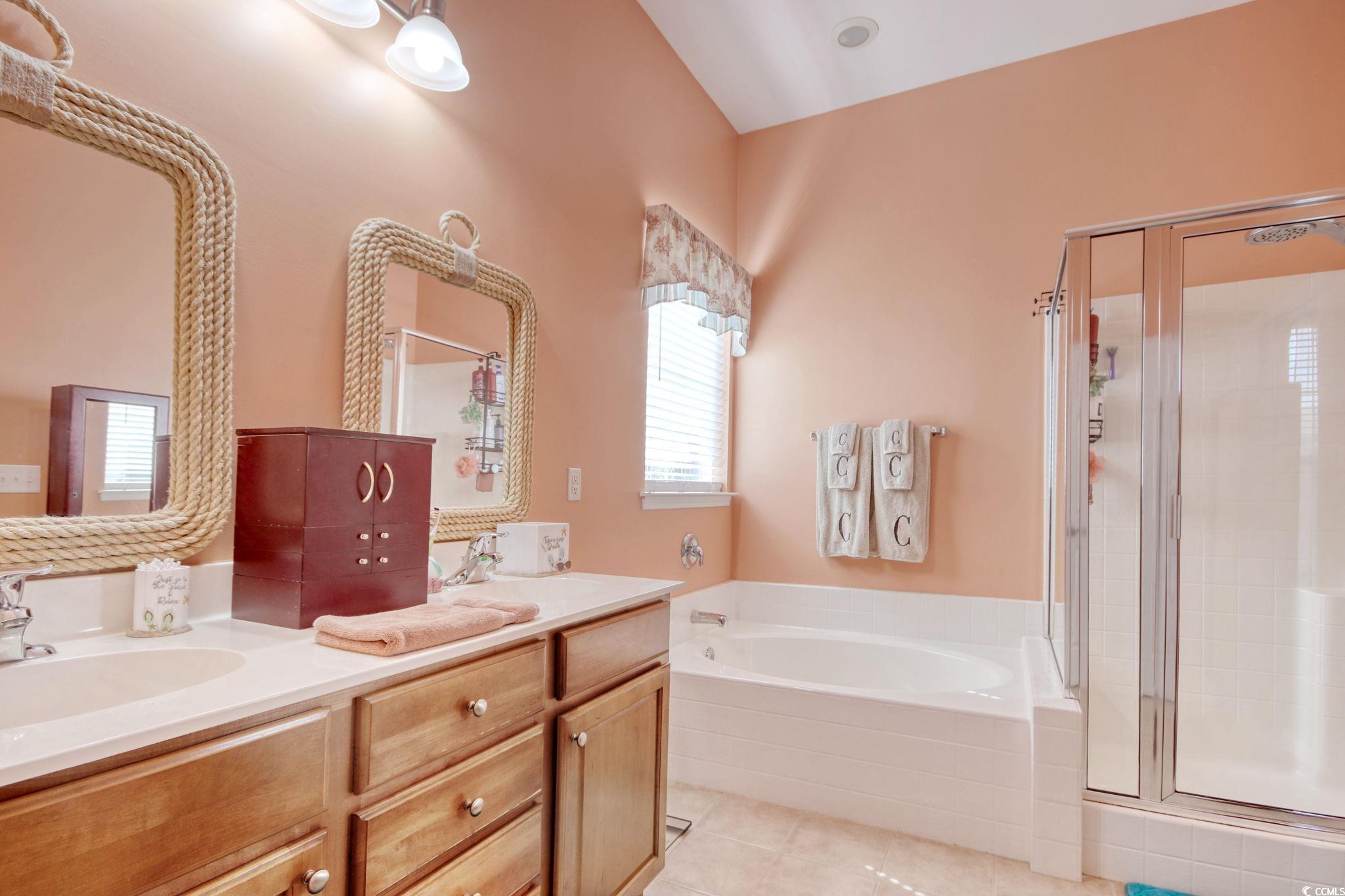 47 Pinfeather Drive Murrells Inlet, SC 29576 - Photo 21 of 35 Full bathroom featuring a shower stall, a bath, double vanity, and light tile patterned floors